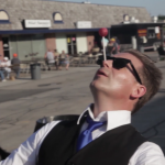 Man balancing a ball on his nose